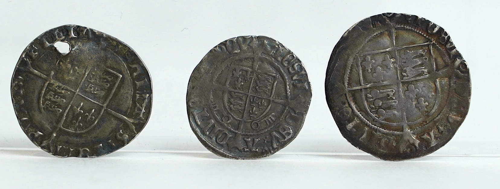 British Tudor hammered silver coins, a Henry VII (1485-1509) halfgroat, York mint, two keys below shield (S2262), fine, a Henry VIII (1509-47) groat, third coinage, c.1544–7, fine, and a Mary (1553-54) groat (S2492), hol